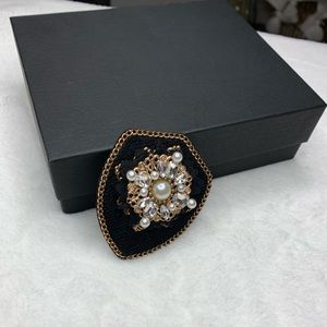 Black with pearls pin